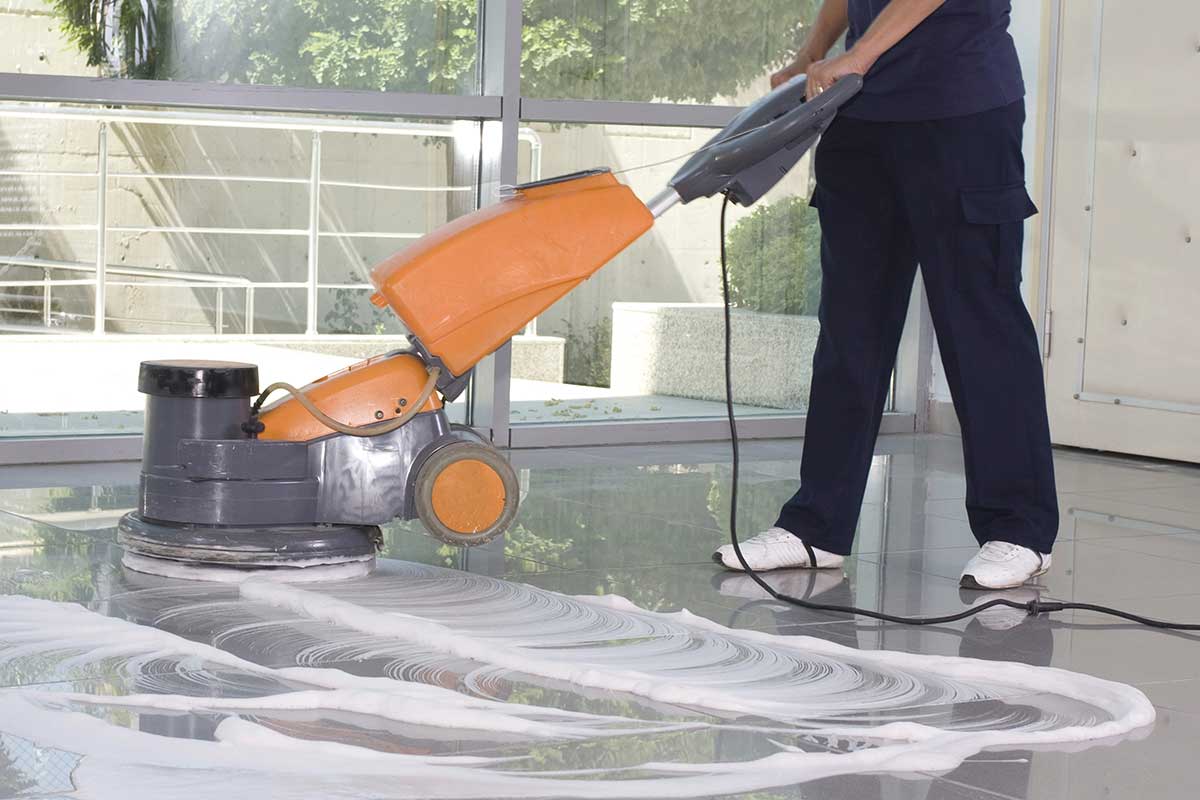 worker using tile cleaner providing Tile Cleaning